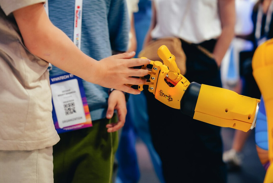 ai robot hand shaking with human